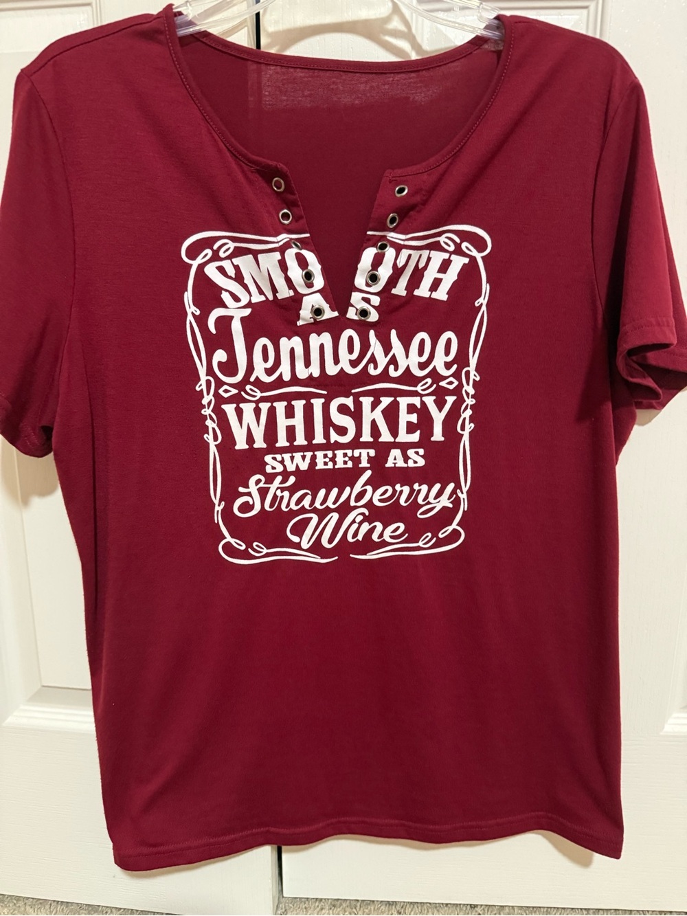 Tennessee Whiskey women’s maroon tshirt with metal eyelets decorations